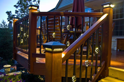 DEKOR™ Millenium post caps and Illuminations balusters at dusk